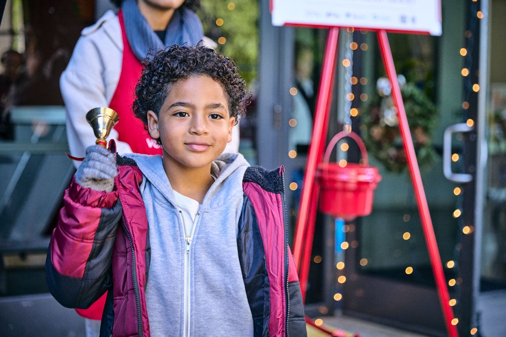 Salvation Army bell ringer at a red kettle