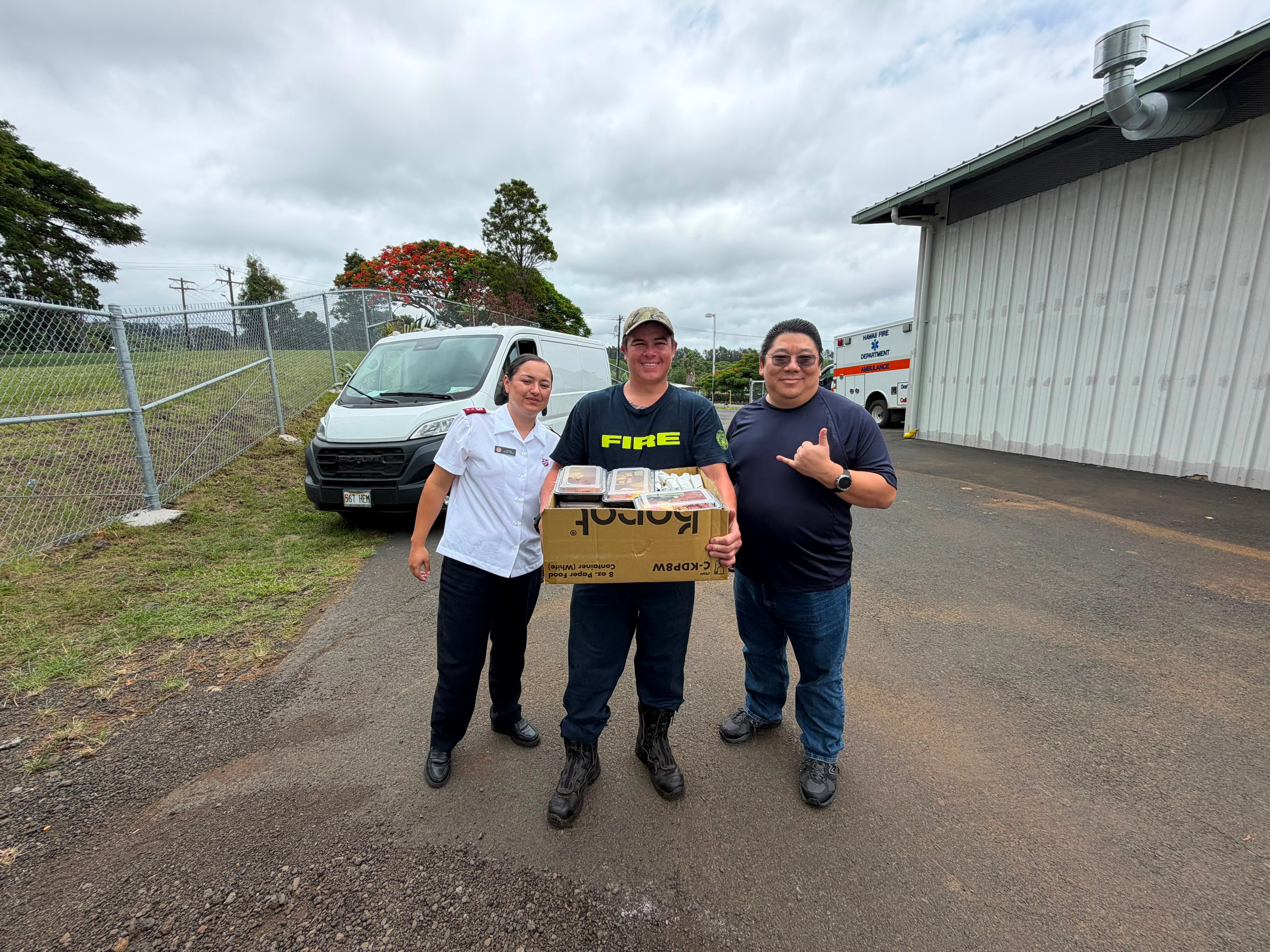 Captain Felicia LeMar and Grant Omura deliver meals to first responders