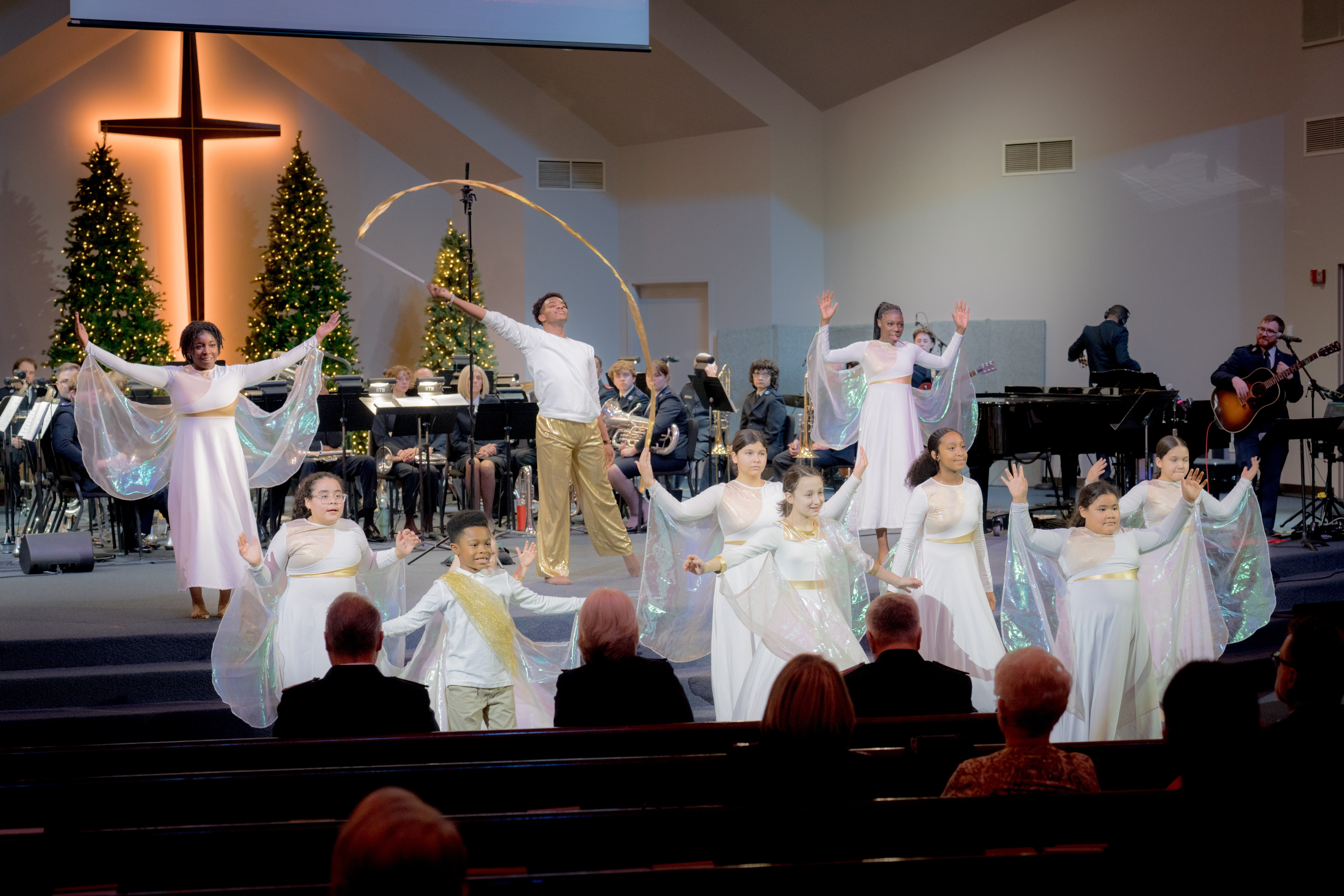 A group takes part in a Christmas worship presentation