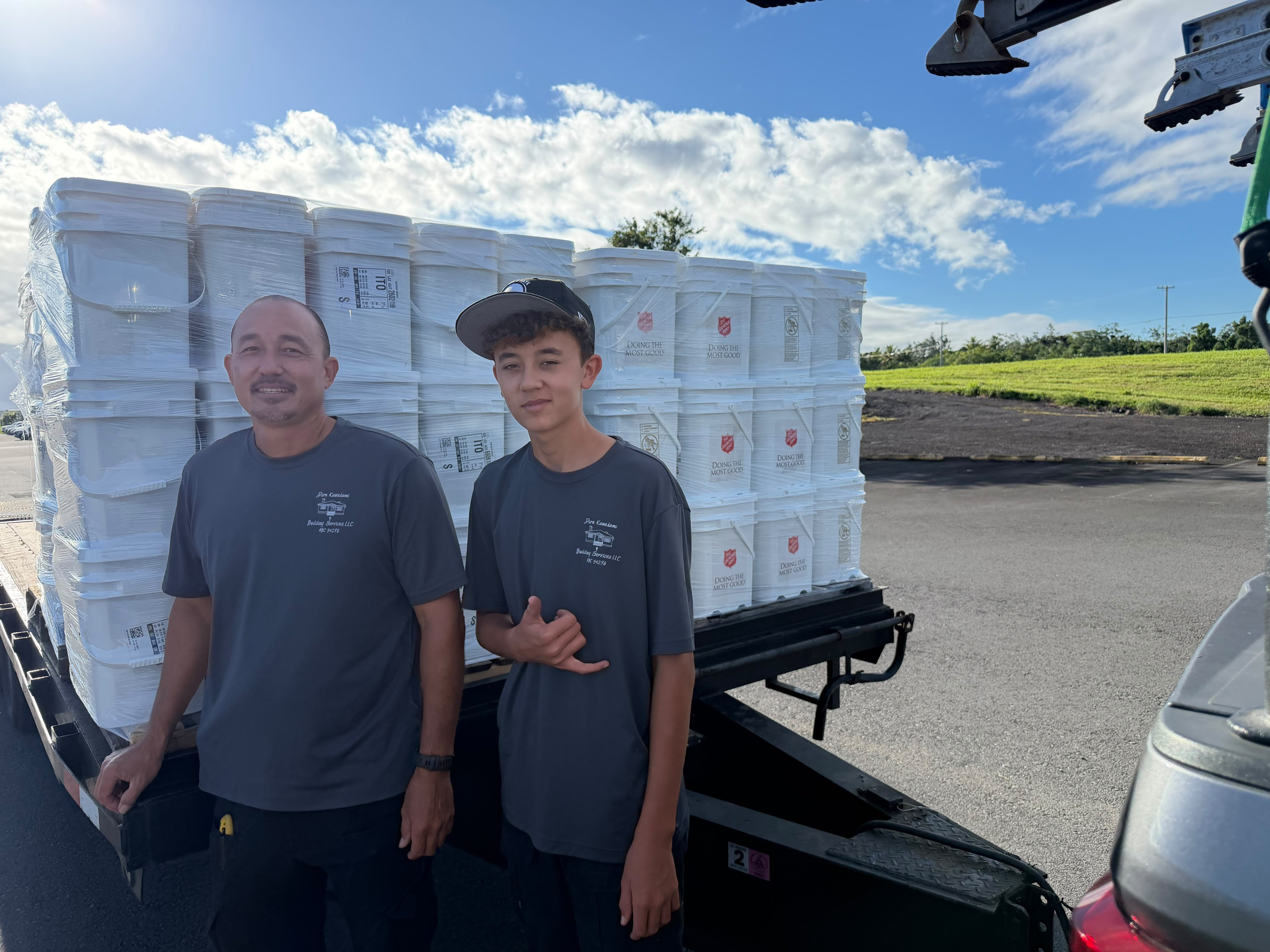 Volunteers in Hilo load cleaning kits to be shipped to Kaua'i for hurricane relief efforts