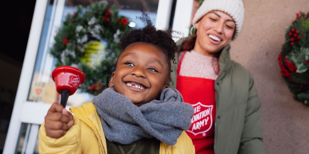 Corporate volunteers and Salvation Army staff standing together