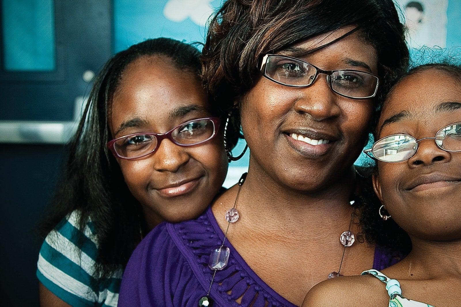 A smiling mother and children
