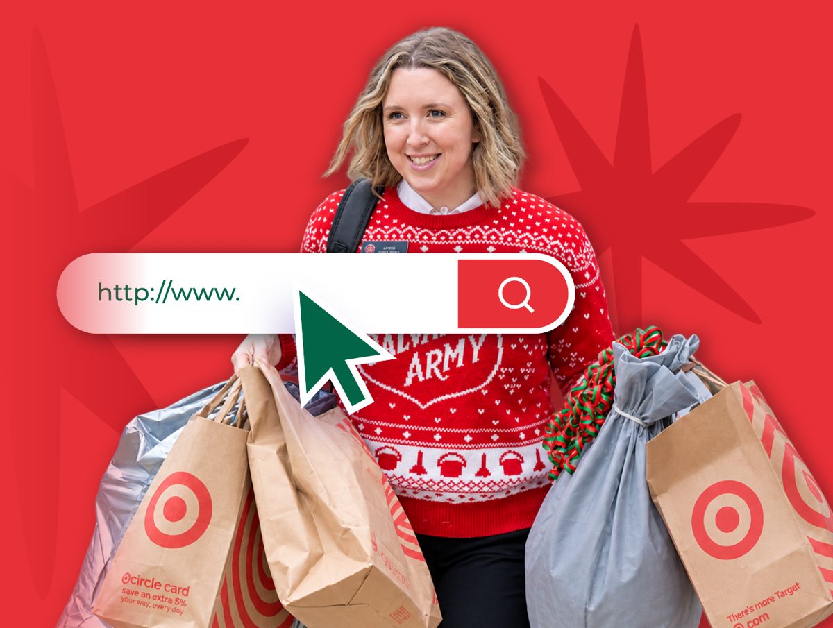 Salvation Army staff member carrying shopping bags of gifts