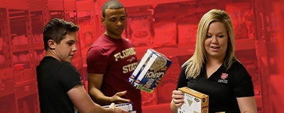 Salvation Army volunteers carrying food in pantry